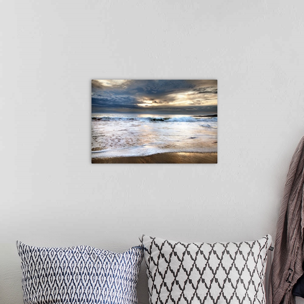 A bohemian room featuring Photograph of foamy waves crashing onto the beach with a stormy sky above.