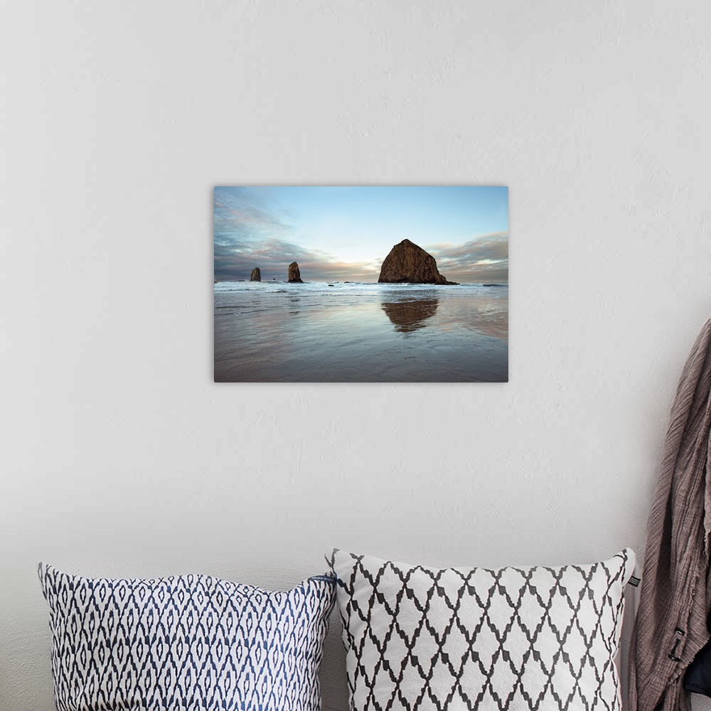 A bohemian room featuring Photograph of large rocks along the coastline of a beach.