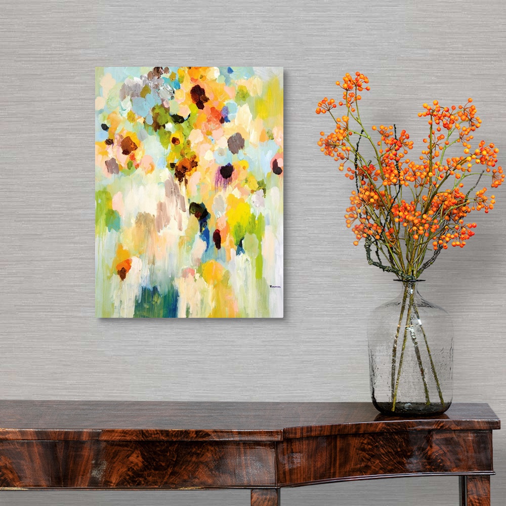 A traditional room featuring An abstract floral painting of a large vase of bright colored flowers blending together in small ...