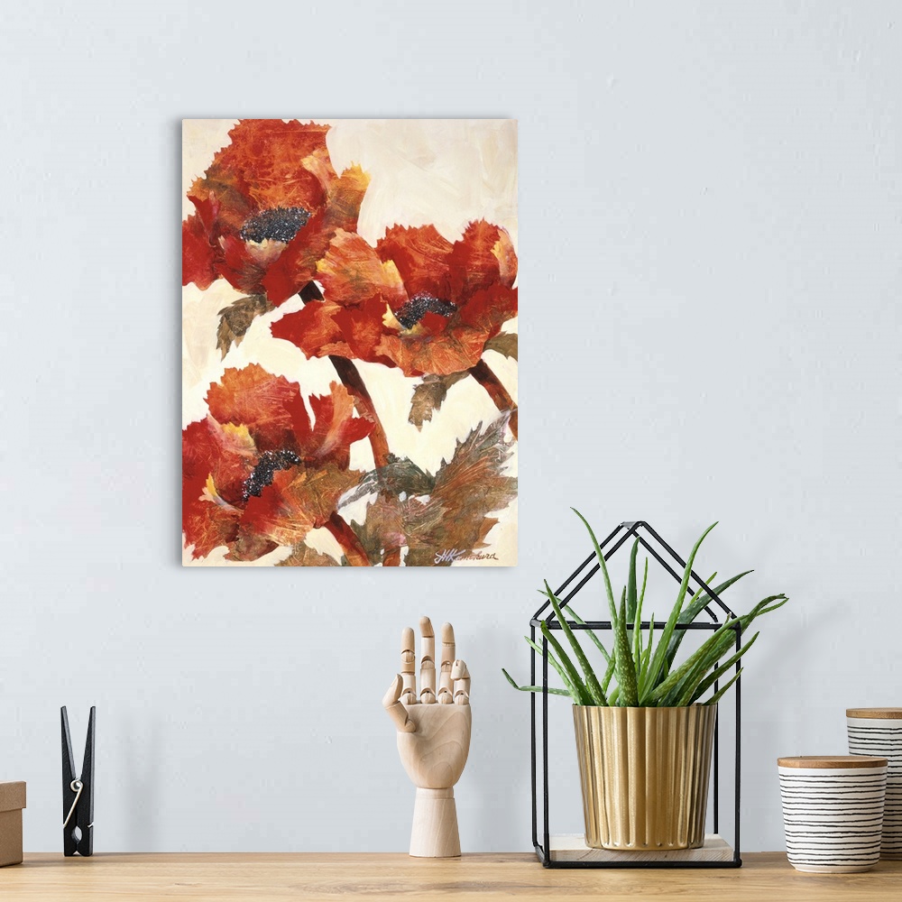 A bohemian room featuring Vertical painting of a group of textured red poppies against a neutral backdrop.