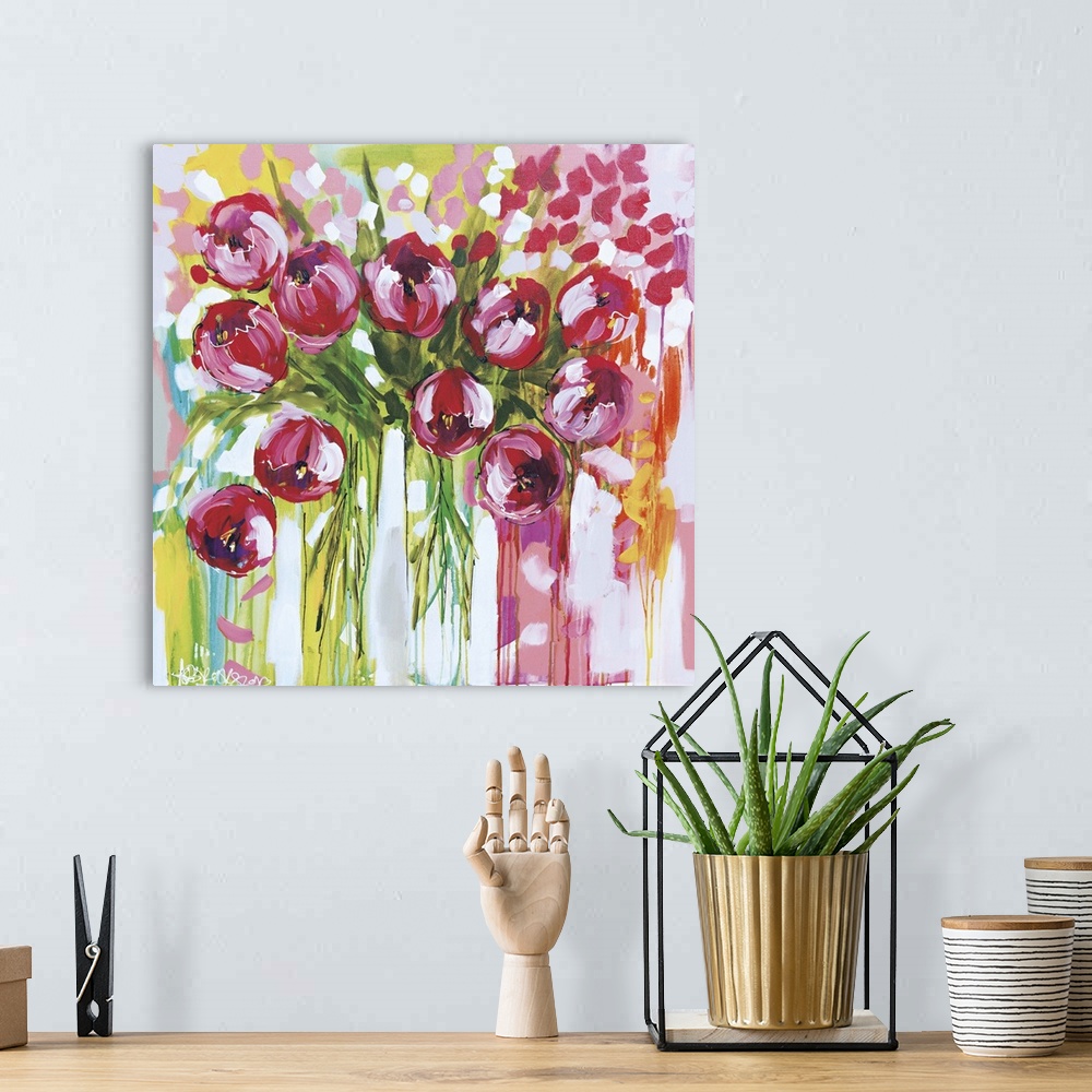 A bohemian room featuring Square contemporary painting of a bunch of pink tulips in vases.