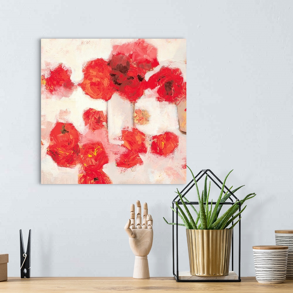 A bohemian room featuring Square painting of red flowers against a white backdrop.  The textured paint gives helps the flow...