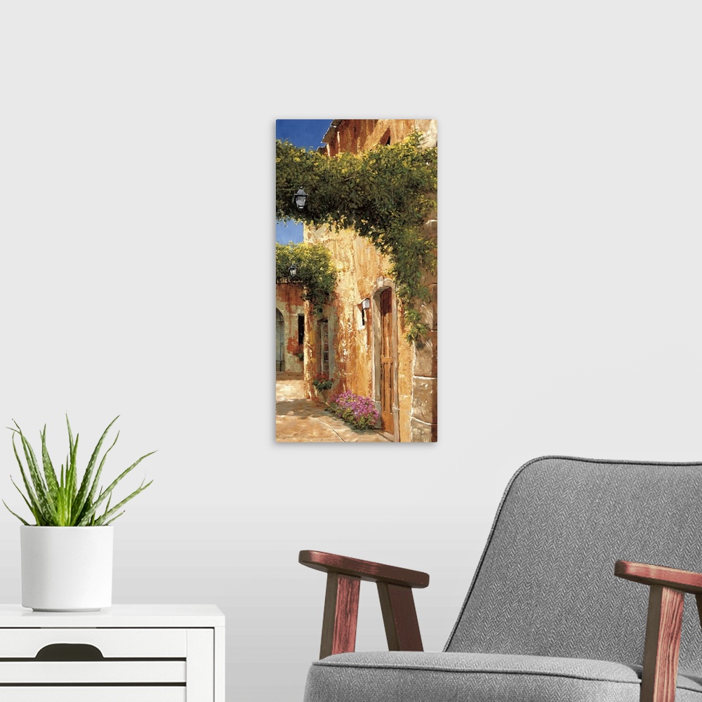 A modern room featuring Artwork of archways covered in vines in a European village.