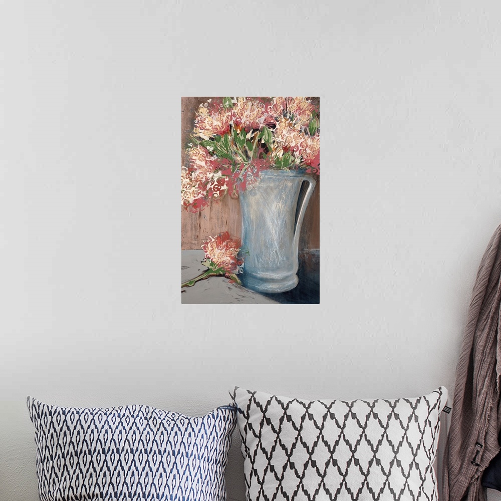 A bohemian room featuring A modern painting of a vase of flowers done in layers of paint with a circular design on the top ...