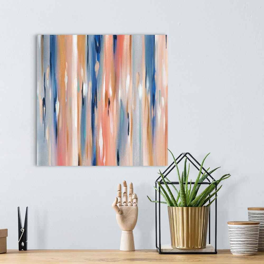 A bohemian room featuring Square abstract in varies shades of blue, pink, orange and white.