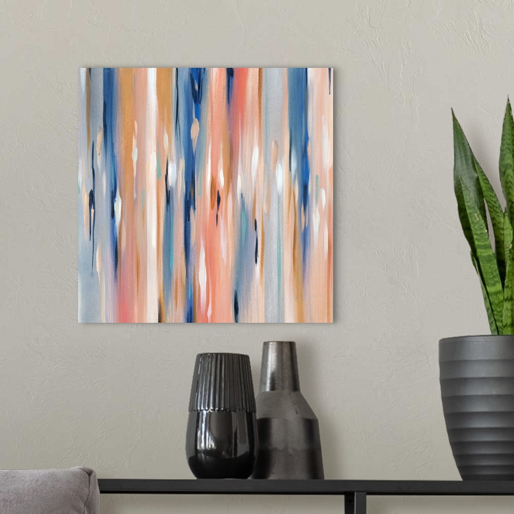 A modern room featuring Square abstract in varies shades of blue, pink, orange and white.
