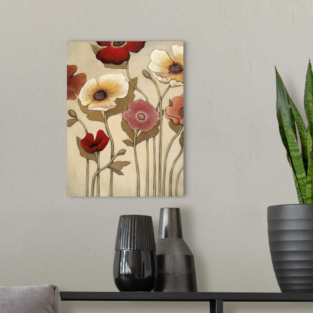 A modern room featuring Vertical painting of a group of red, pink and yellow flowers against a neutral backdrop.