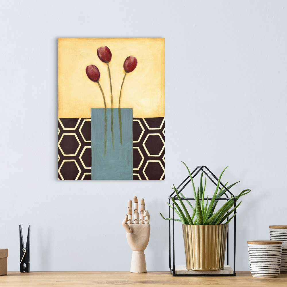 A bohemian room featuring Vertical painting of a vase of red tulips with modern patterned backdrop.