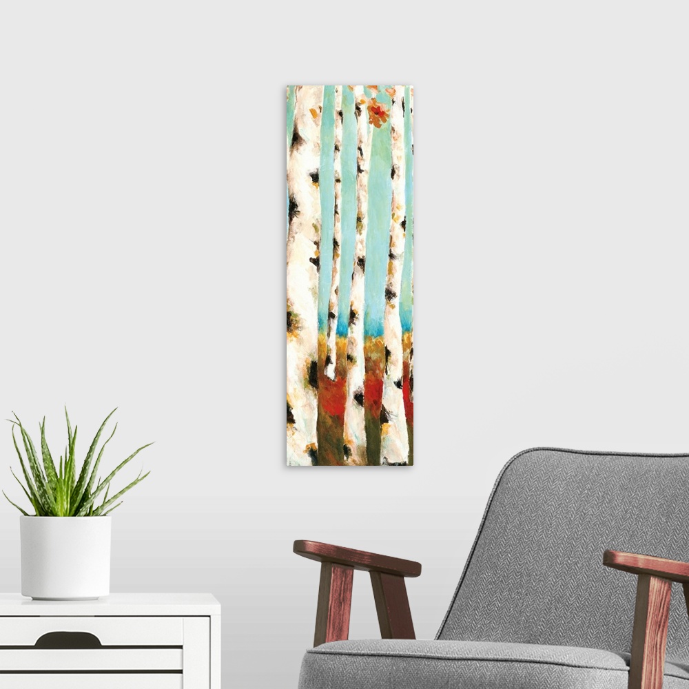 A modern room featuring A long vertical painting of white birch trees with warm colored grass and leaves.