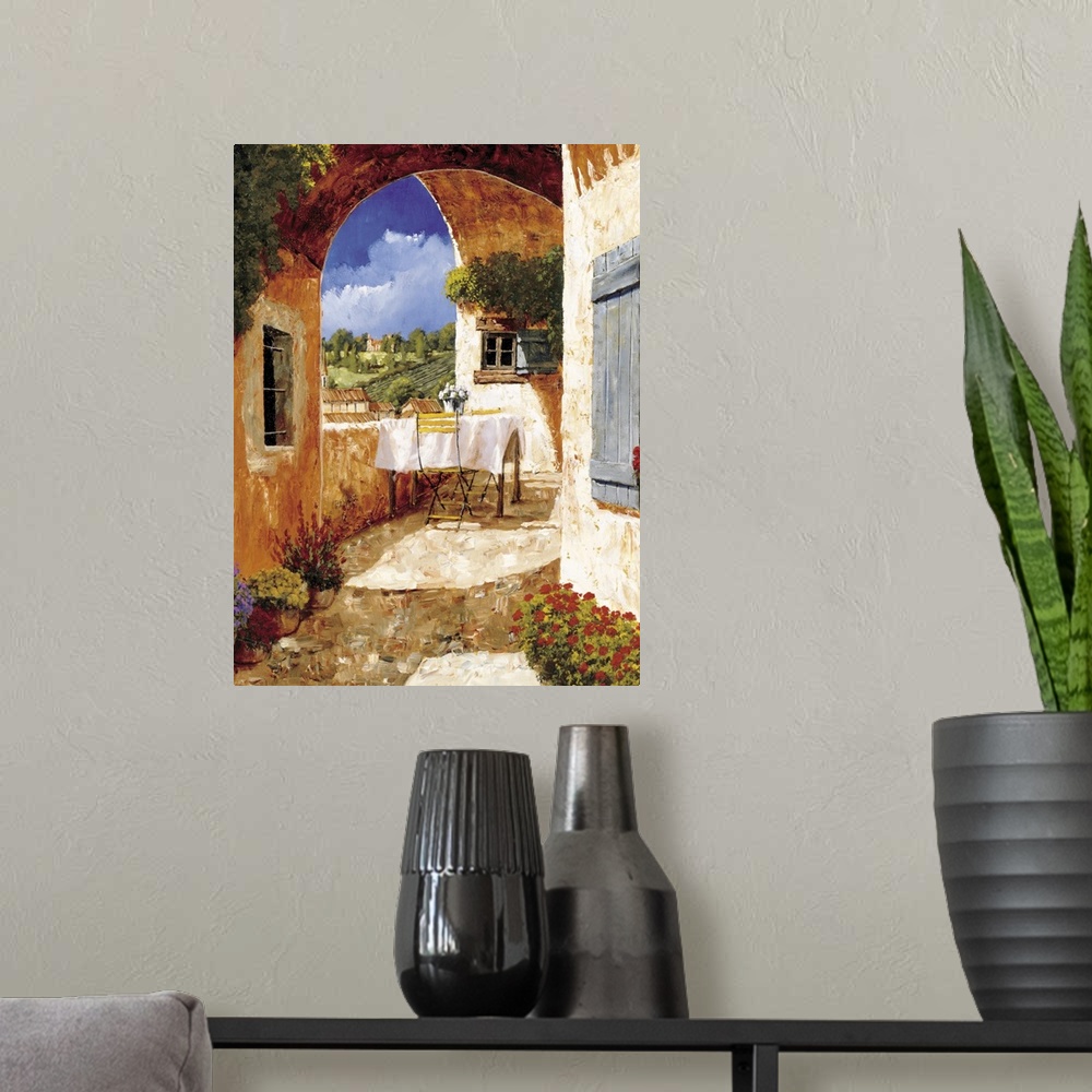 A modern room featuring Contemporary artwork of a Tuscan villa on a sunny day.