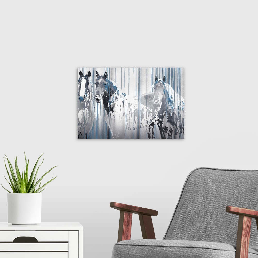 A modern room featuring A composite image of three horses in tones of gray with drips of blue paint overlapping the image.