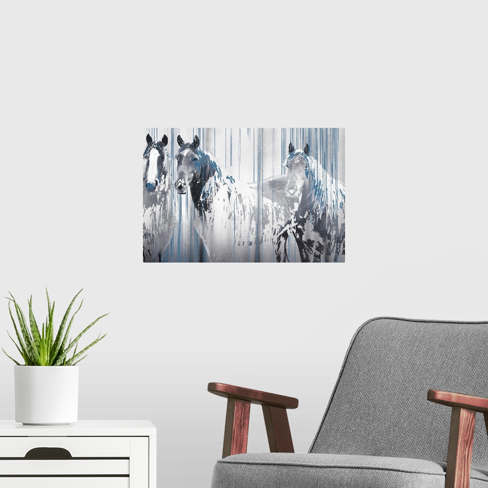 A modern room featuring A composite image of three horses in tones of gray with drips of blue paint overlapping the image.