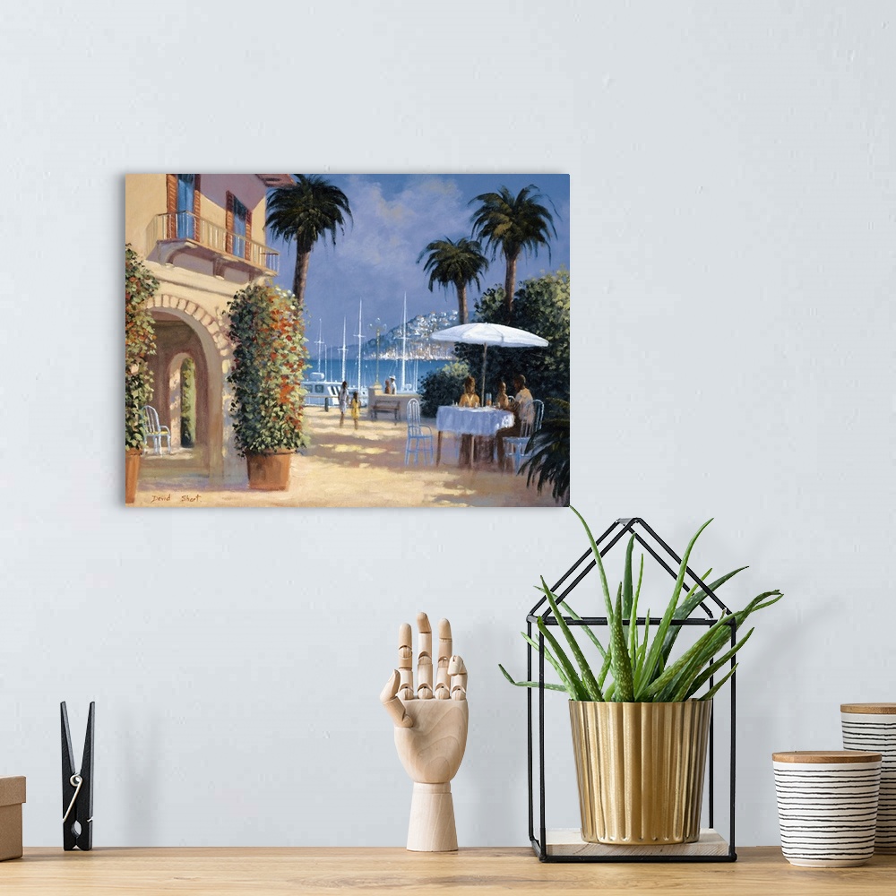 A bohemian room featuring Contemporary artwork of an outdoor bistro in the sun in a seaside town.