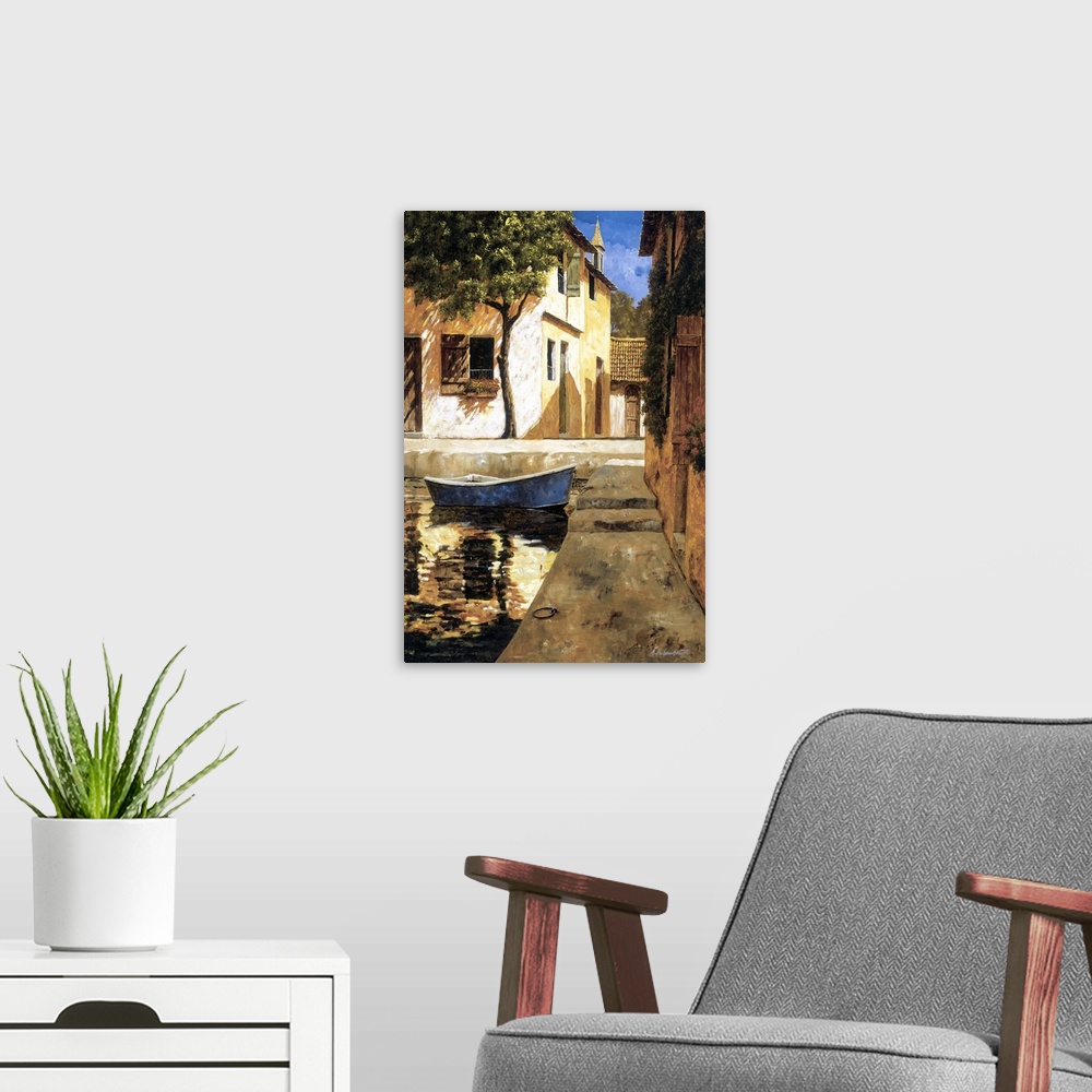 A modern room featuring Painting of a boat docked near stairs in a European village.