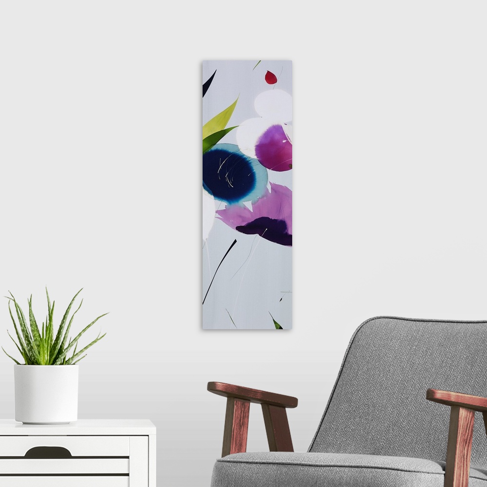 A modern room featuring A long vertical painting in a modern design of flowers in cool tones.