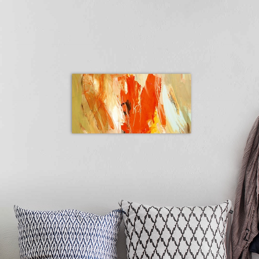 A bohemian room featuring A horizontal abstract painting in vibrant colors of orange, yellow and white.