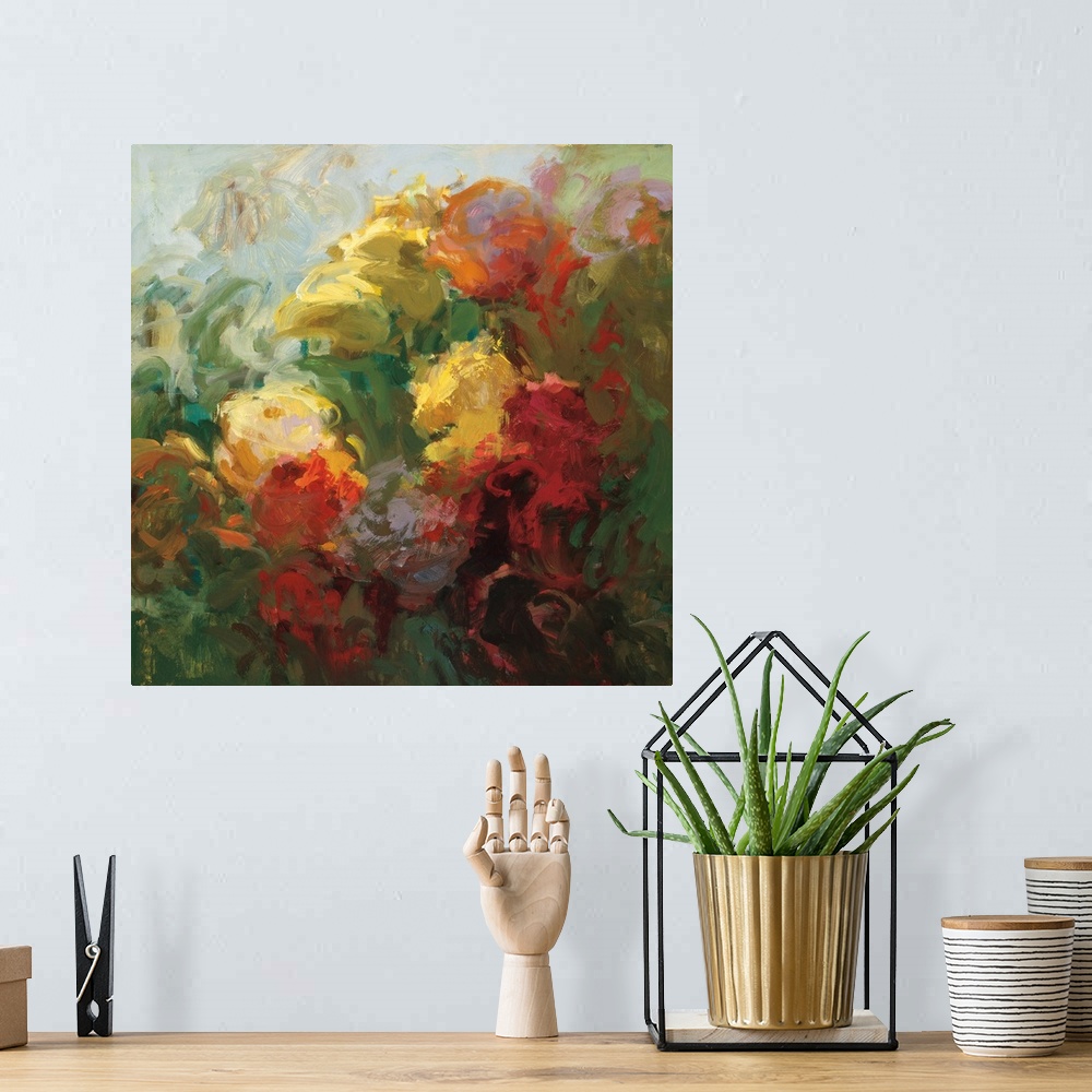 A bohemian room featuring An abstract floral painting in vibrant colors of red, yellow and green.