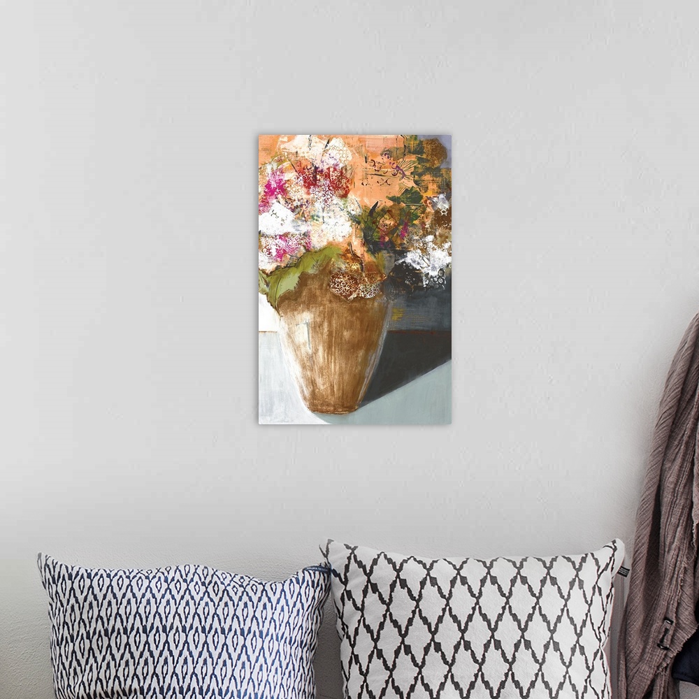A bohemian room featuring A modern painting of a vase of flower done in layers of paint with a circular design on the top l...