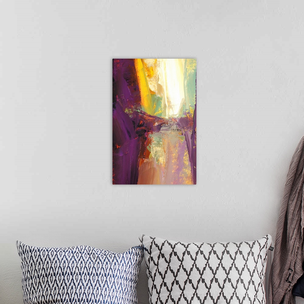 A bohemian room featuring A vertical abstract painting in vibrant colors of purple, yellow and red.