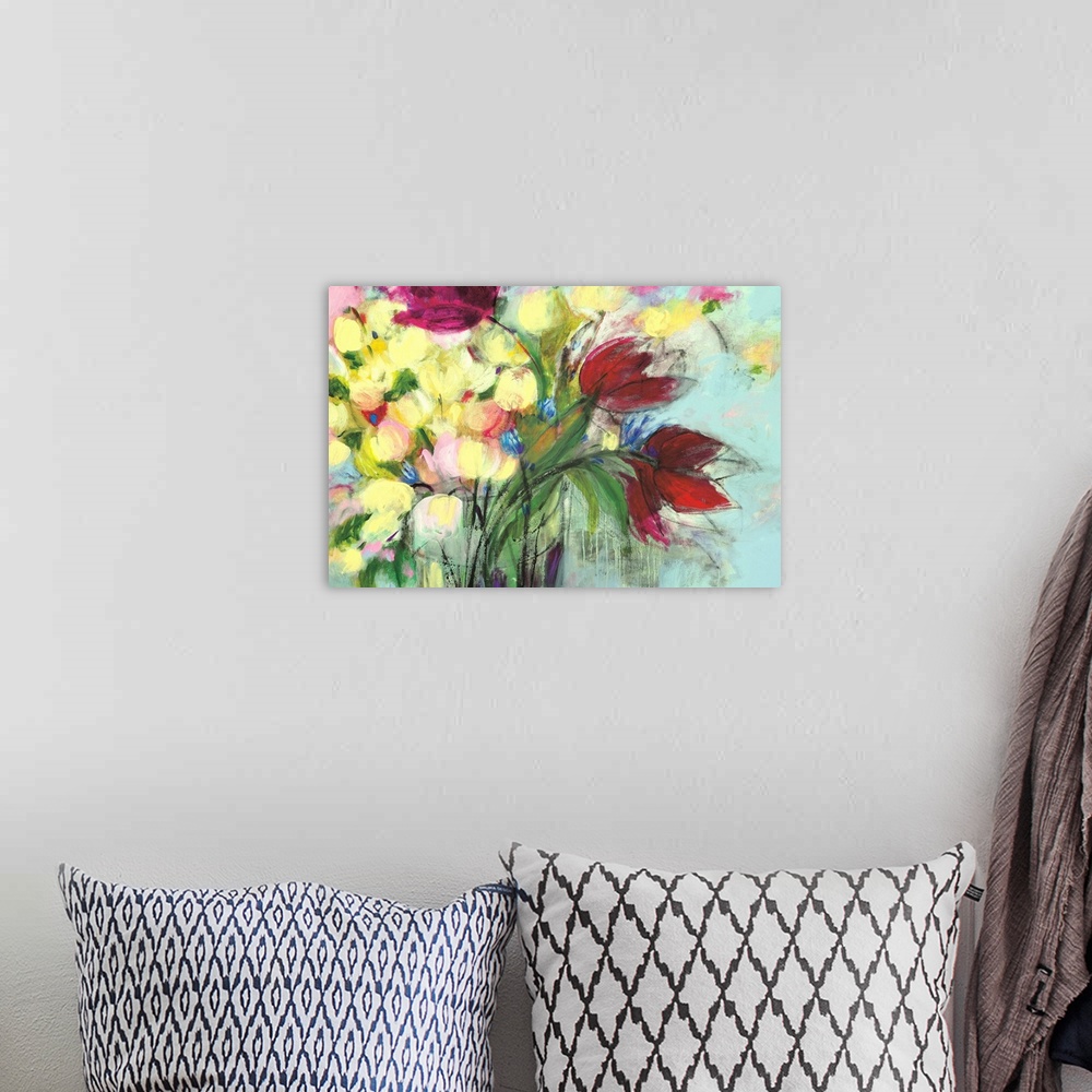 A bohemian room featuring A delicate, soft painting of colorful flowers in a glass vase.