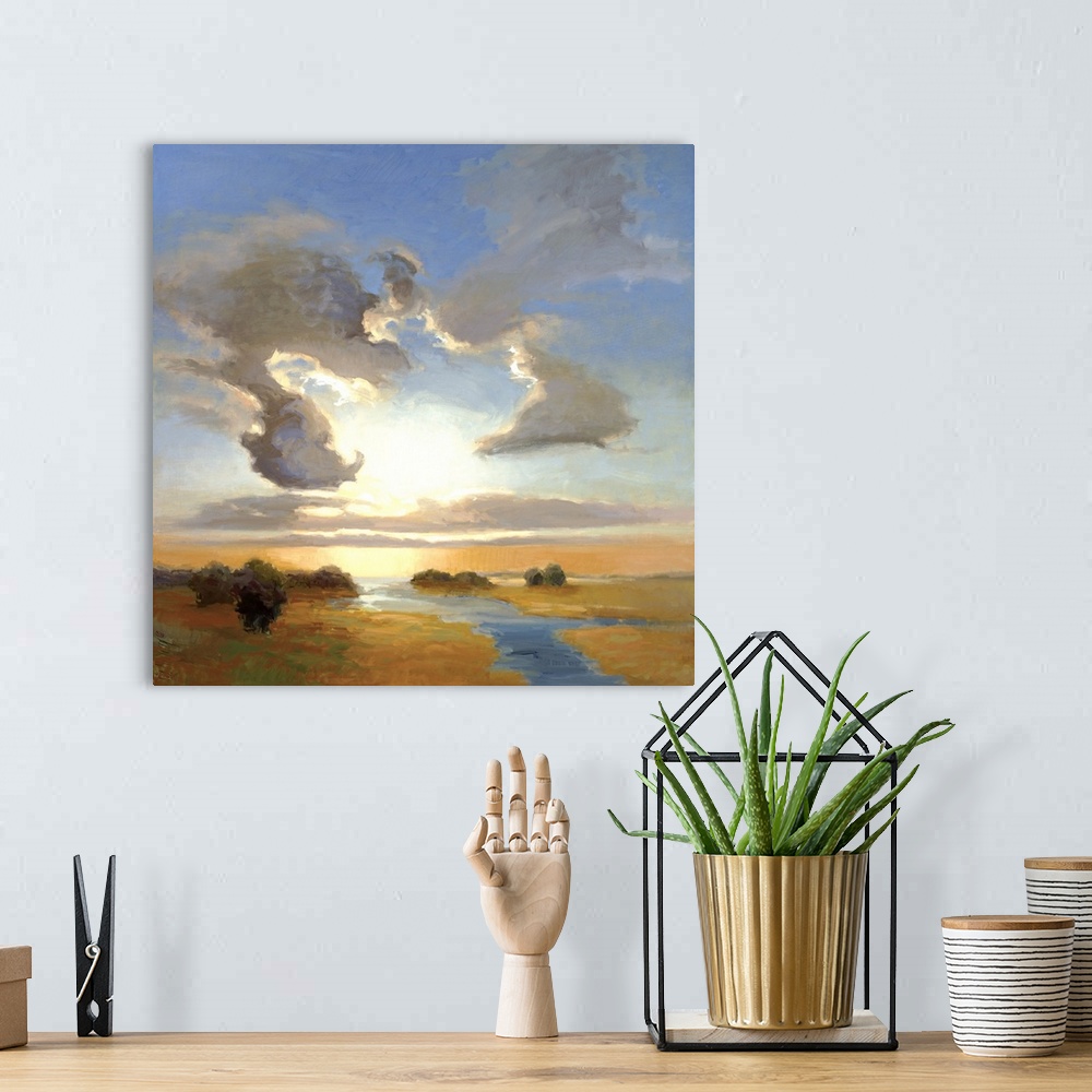 A bohemian room featuring Square painting of a steam cutting through the landscape with large clouds in the sky above.