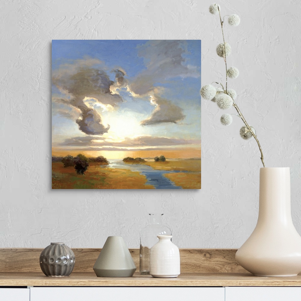 A farmhouse room featuring Square painting of a steam cutting through the landscape with large clouds in the sky above.