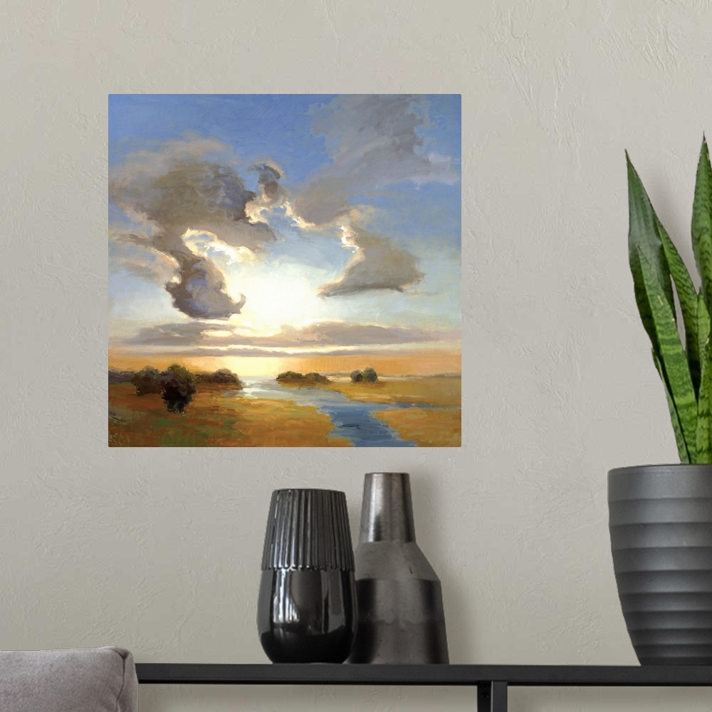 A modern room featuring Square painting of a steam cutting through the landscape with large clouds in the sky above.