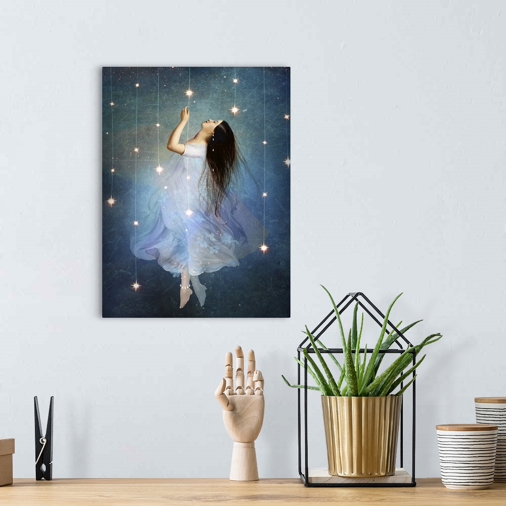 A bohemian room featuring A conceptual artwork of a female floating in stars.