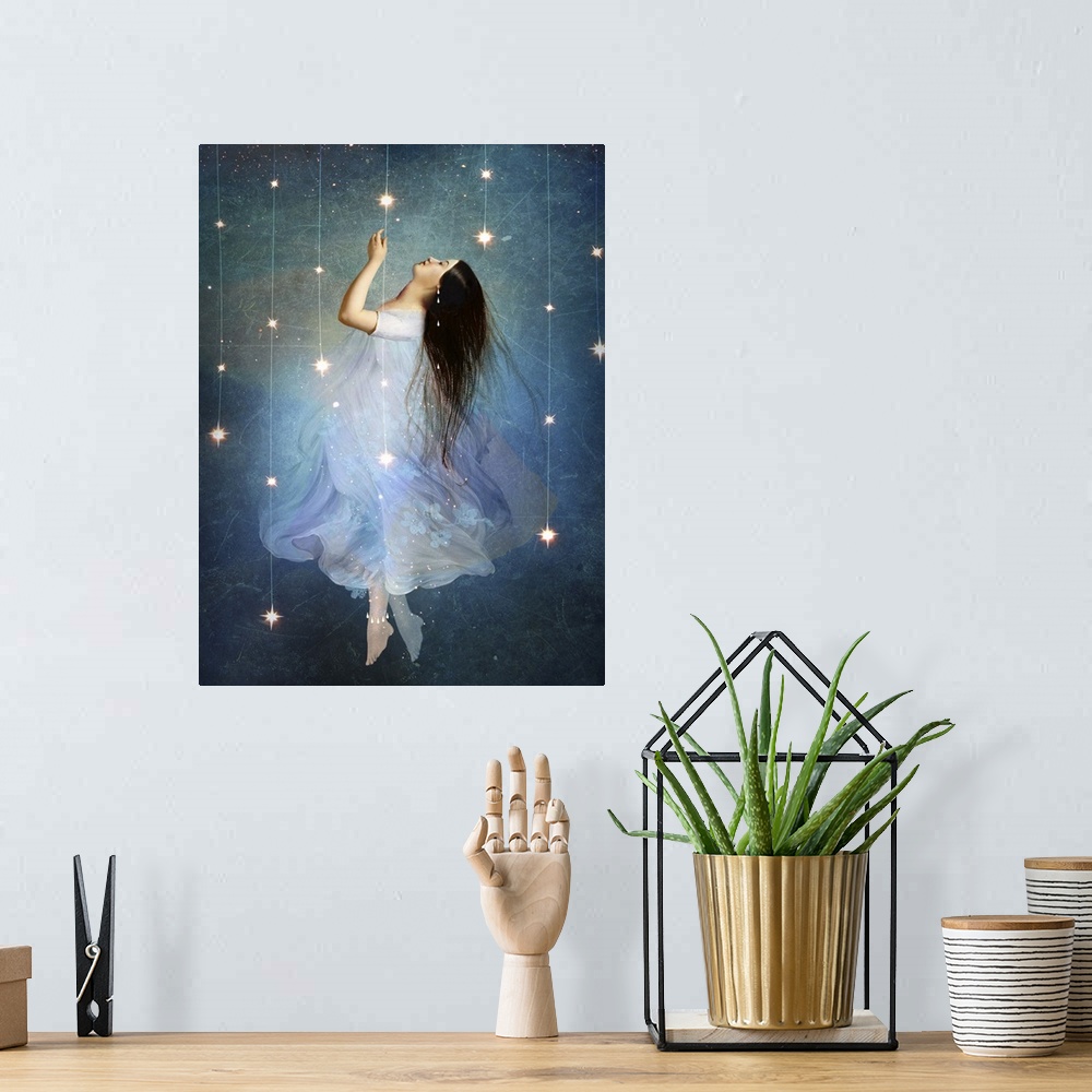 A bohemian room featuring A conceptual artwork of a female floating in stars.