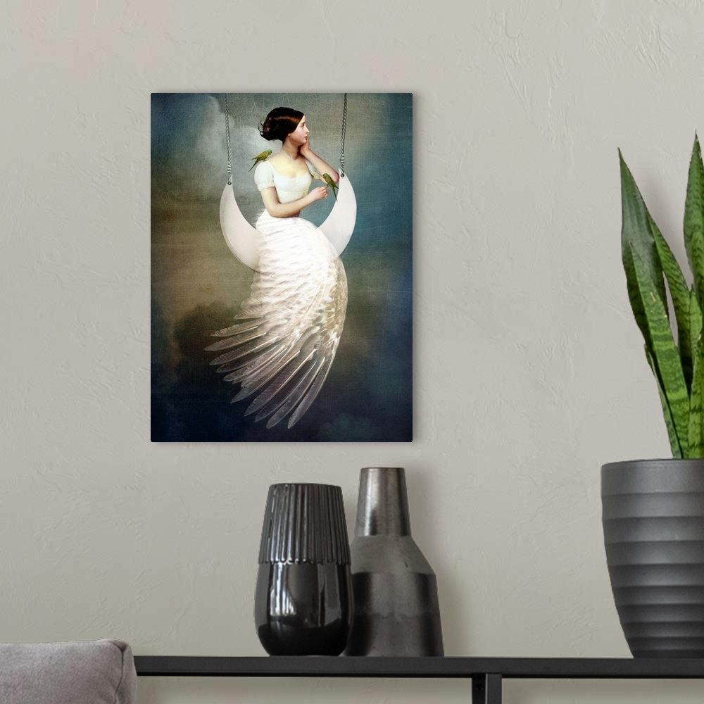 A modern room featuring A conceptual portrait of a female with a feather dress sitting on a moon swing.