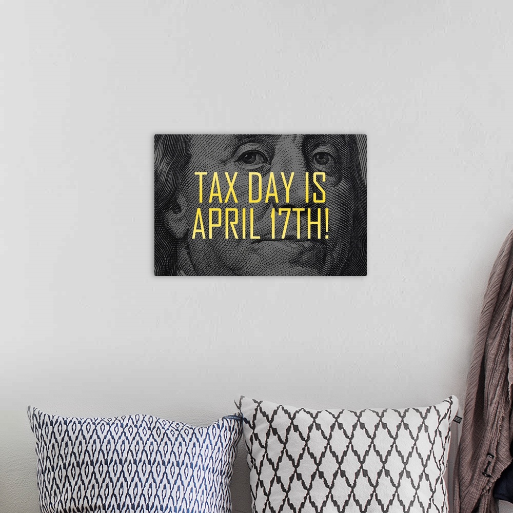 A bohemian room featuring "Tax Day Is April 17th!" written in yellow on top of Ben Franklin's face from the one hundred dol...