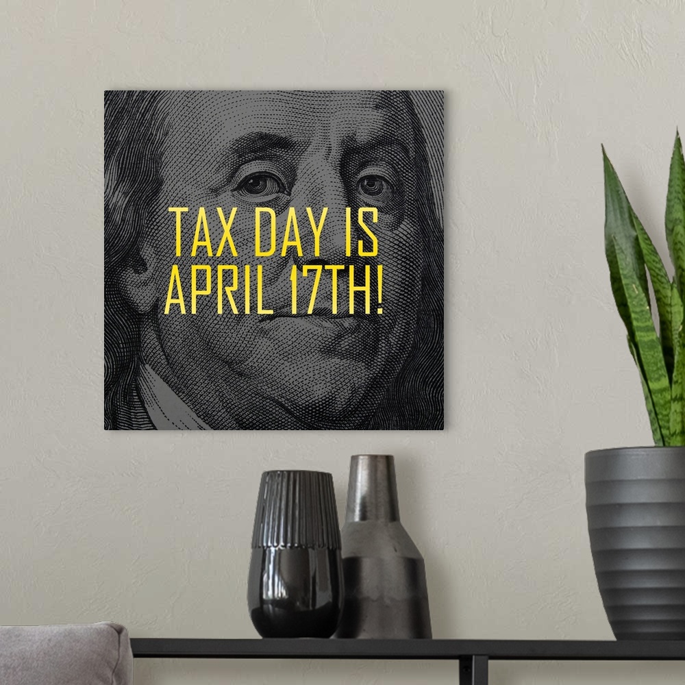 A modern room featuring "Tax Day Is April 17th!" written in yellow on top of Ben Franklin's face from the one hundred dol...
