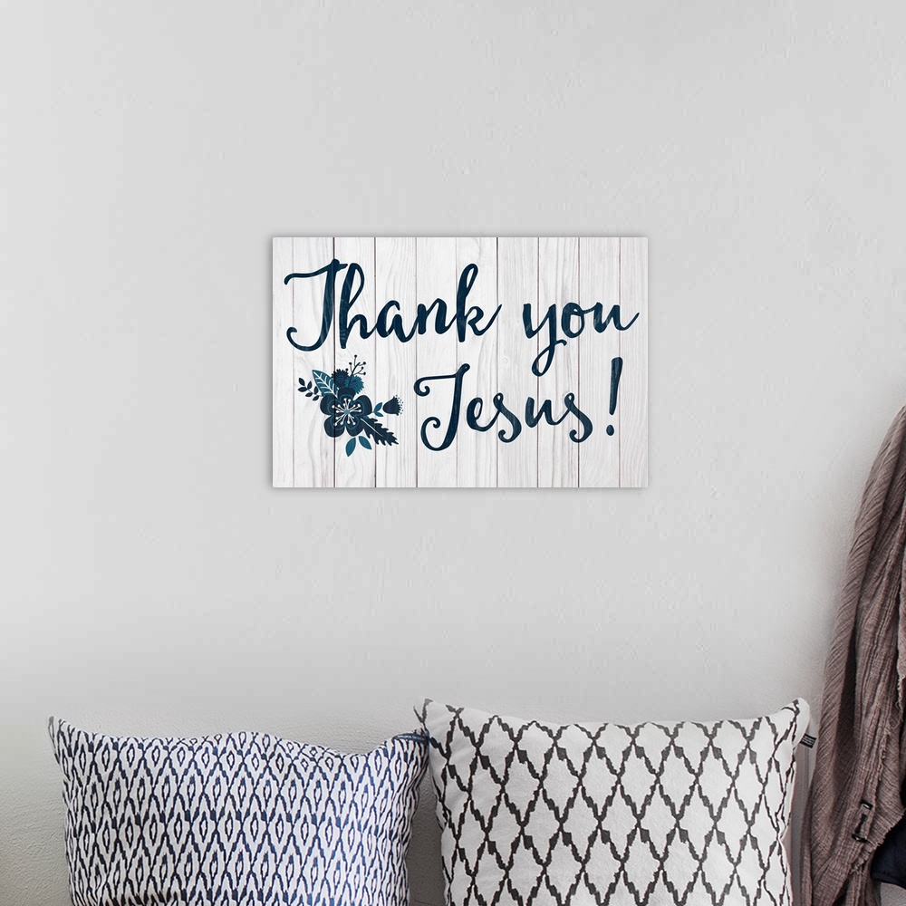A bohemian room featuring "Thank you Jesus" in navy with a flower, on a gray wood backdrop.
