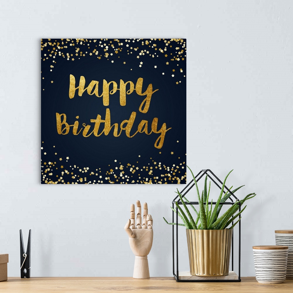 A bohemian room featuring "Happy Birthday" written in gold with sparkles on the top in bottom on a dark blue background.