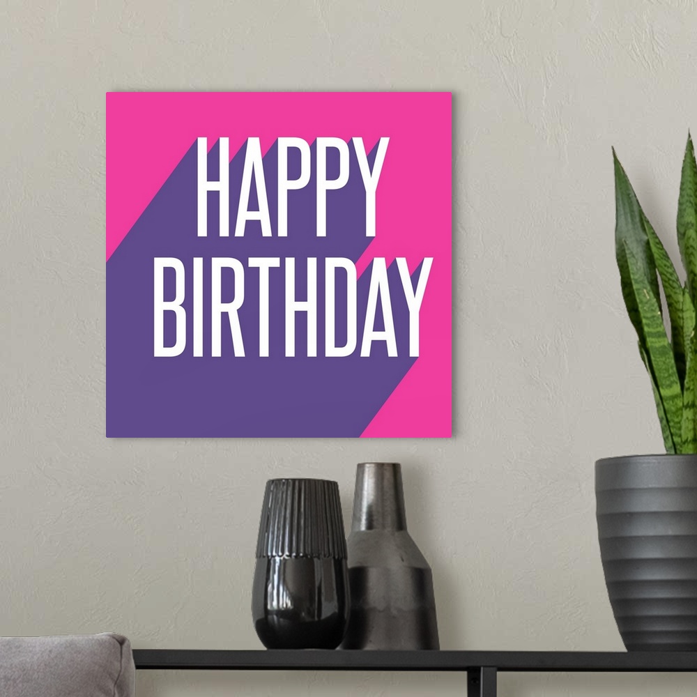 A modern room featuring Graphic pop art style text that reads "Happy Birthday"