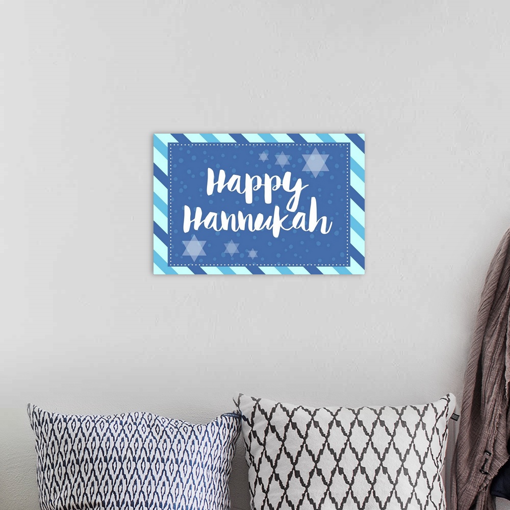 A bohemian room featuring Graphic holiday art in cool tones with large text surrounded by Star of David graphics and a diag...