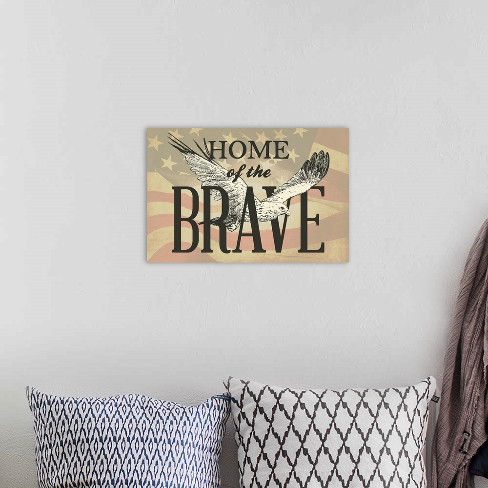 A bohemian room featuring "Home of the Brave" written in black with an illustration of an eagle flying though it, all on a ...