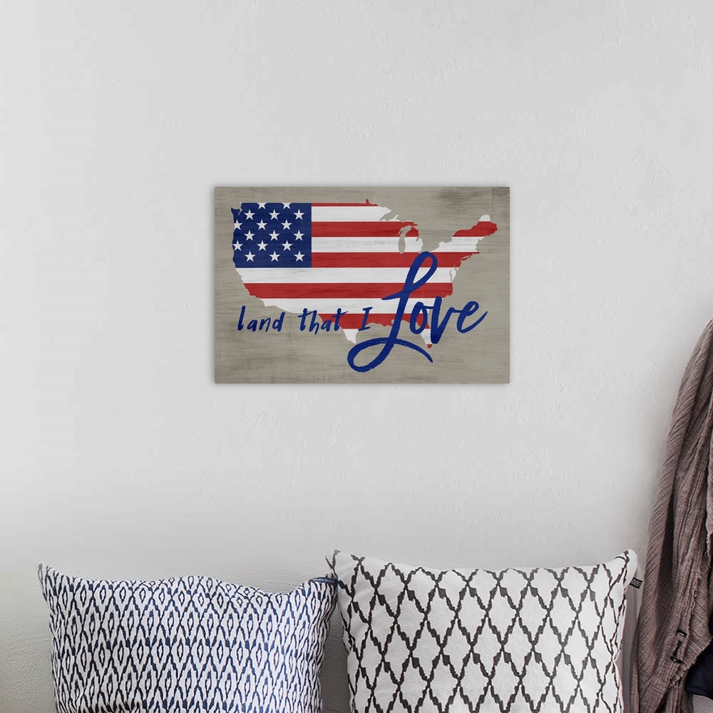 A bohemian room featuring "Land That I Love" written in blue over an American Flag in the shape of the United States on a n...