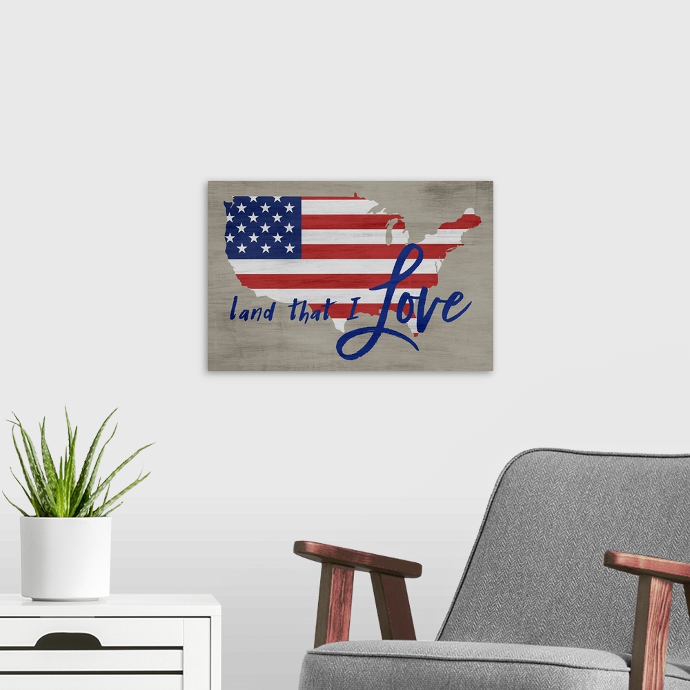 A modern room featuring "Land That I Love" written in blue over an American Flag in the shape of the United States on a n...