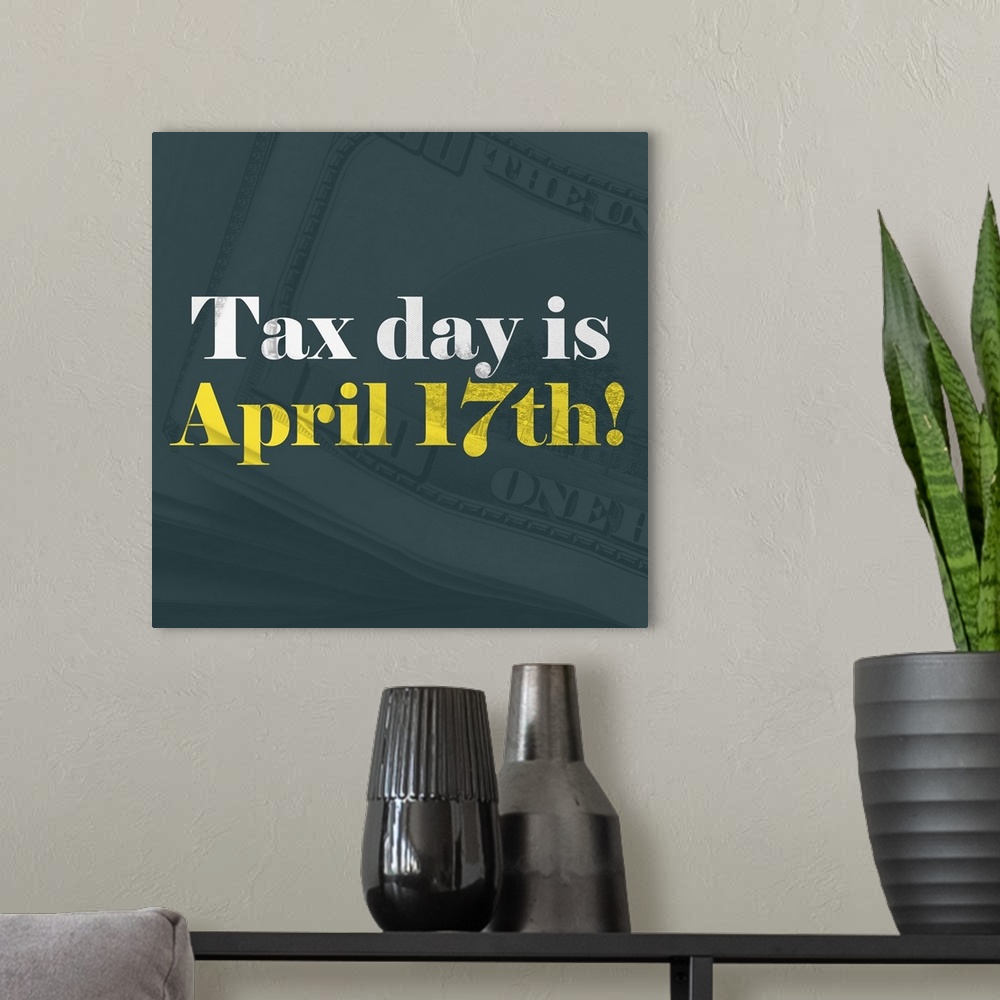 A modern room featuring "Tax Day Is April 17th!" written in white and yellow on top of a teal background with stacks of o...