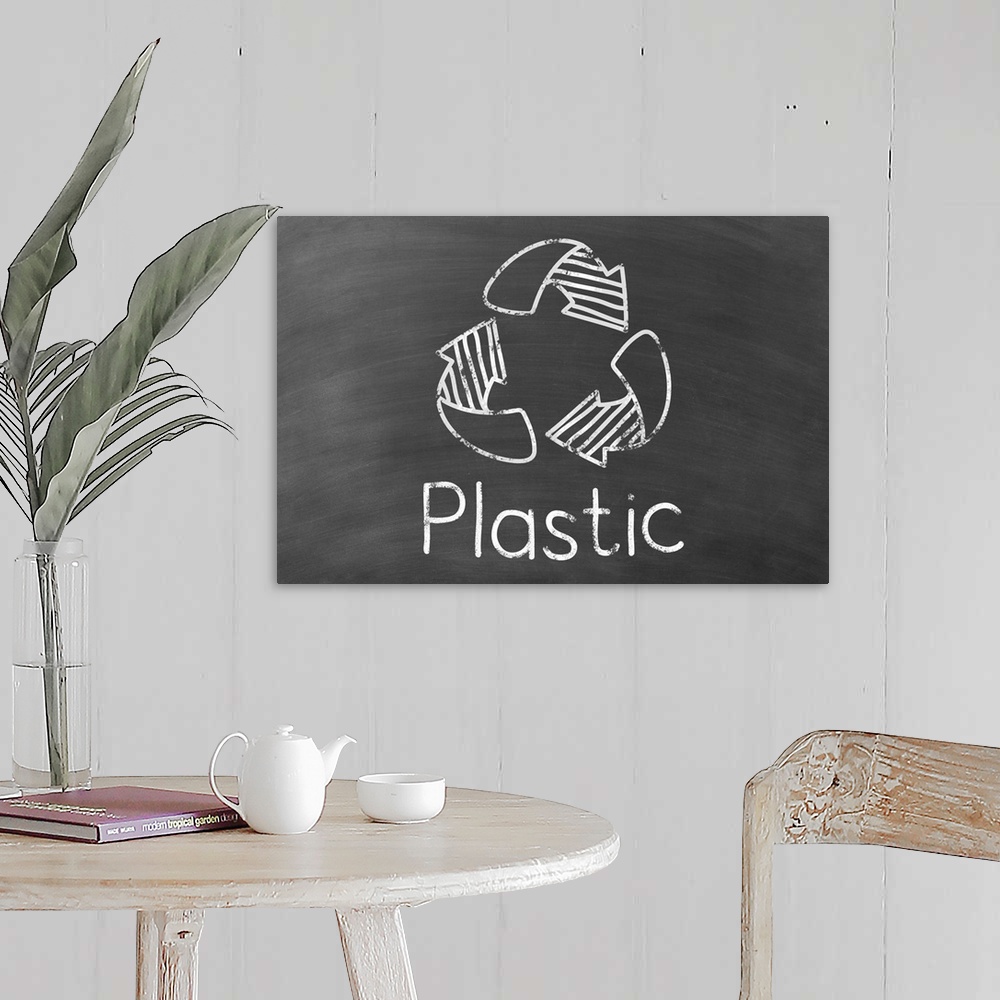 A farmhouse room featuring Recycling symbol with "Plastic" written underneath in white on a black chalkboard background.
