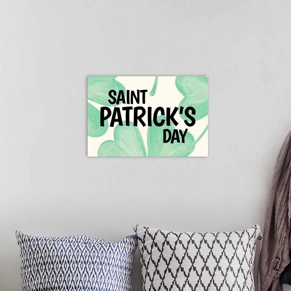 A bohemian room featuring "Saint Patrick's Day" written in black over large illustrated clovers.