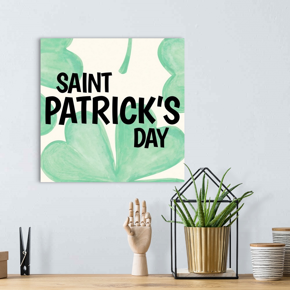 A bohemian room featuring "Saint Patrick's Day" written in black over large illustrated clovers.