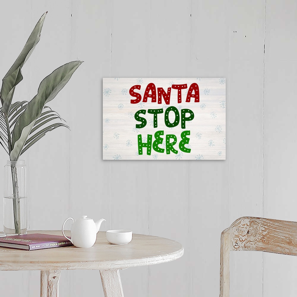 A farmhouse room featuring Graphic holiday art with large decorative text on a horizontally striped background with light sn...