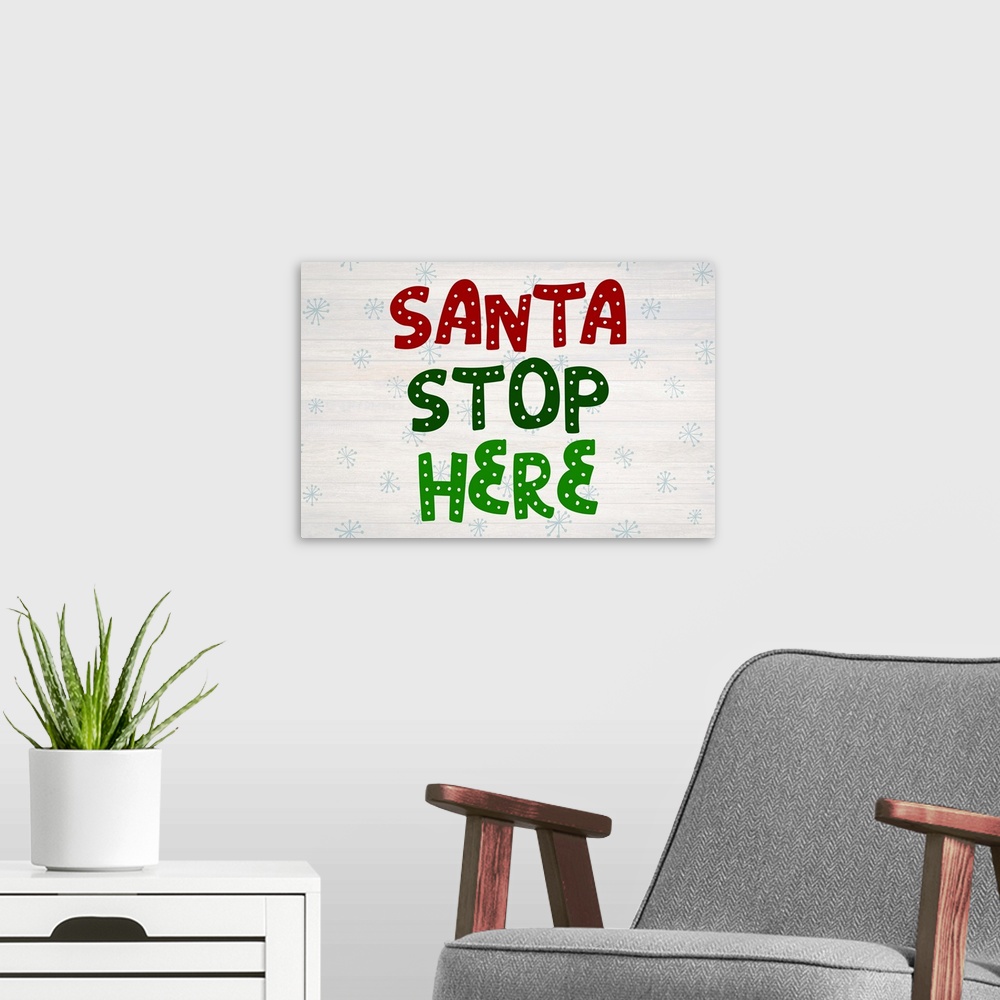 A modern room featuring Graphic holiday art with large decorative text on a horizontally striped background with light sn...