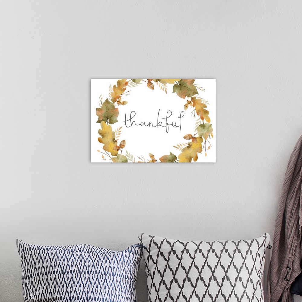 A bohemian room featuring Graphic holiday art with the word "Thankful" written inside an Autumn wreath made up of leaves an...