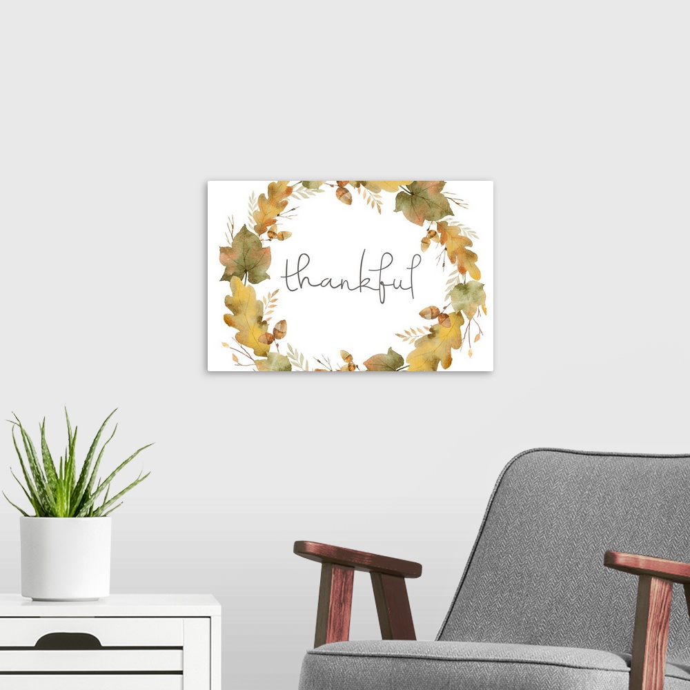 A modern room featuring Graphic holiday art with the word "Thankful" written inside an Autumn wreath made up of leaves an...