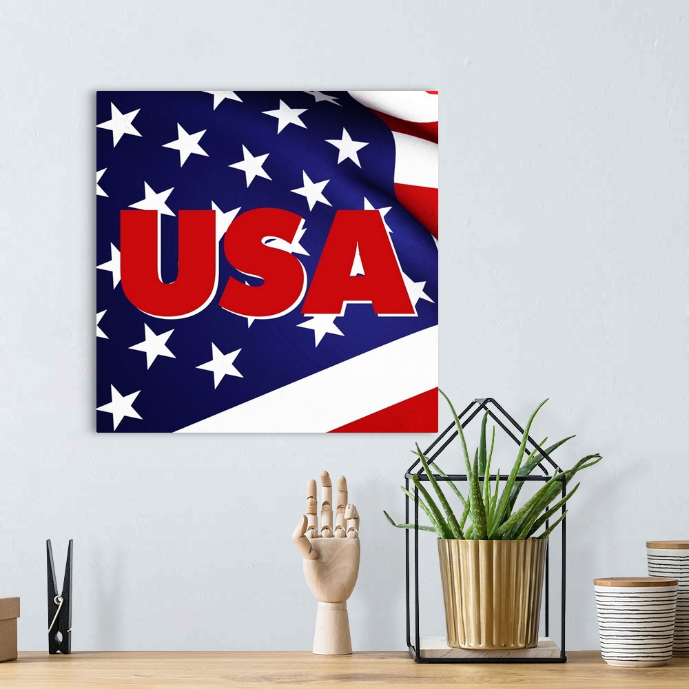 A bohemian room featuring USA in red on top of a waving American Flag.