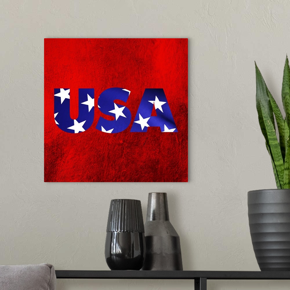 A modern room featuring Patriotic art that has USA in blue with white stars on a red background.