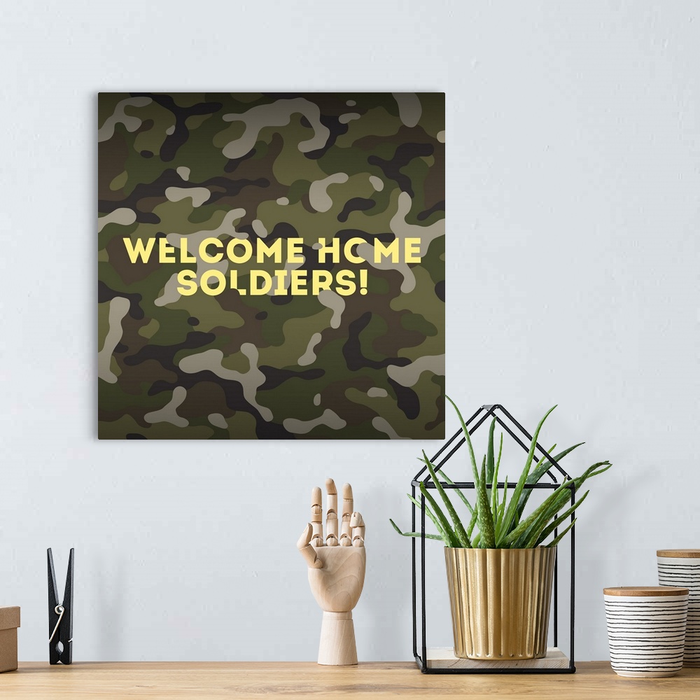 A bohemian room featuring "Welcome Home Soldiers!" written in yellow on a camouflaged background.